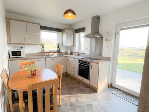 Honeybee Cottage Valentia. Self catering holiday home Co. Kerry.  Bright kitchen, views to garden.