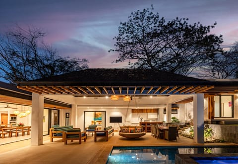 Outdoor lounge area, kitchen and pool