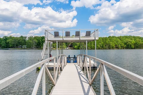 Your double decker dock with 4 lounge chairs, slip, 1 kayak, and there are 2 tables to sit around on the landing