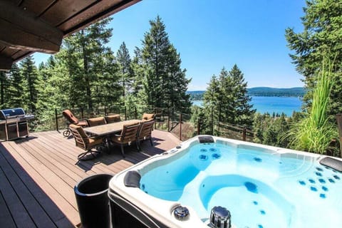 Spacious Deck with a Soothing Hot Tub, 8-seat outdoor table and Amazing Lake Views | Exterior