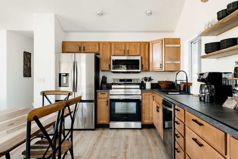 Eat in Kitchen with ample counterspace is fully stocked will all your needs.