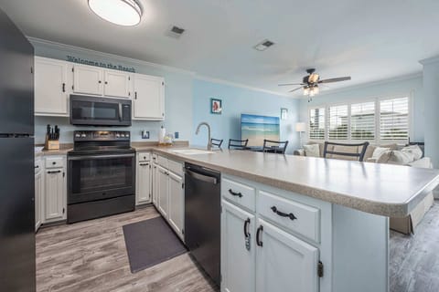 The open, airy kitchen offers ample space & every home comfort