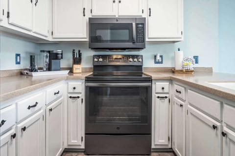 The open, airy kitchen offers ample space & every home comfort