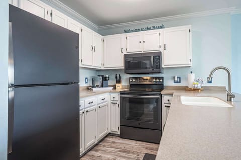 The open, airy kitchen offers ample space & every home comfort