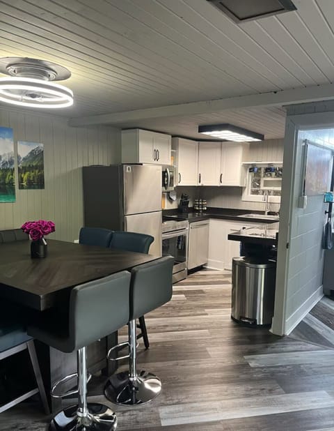 Bright and open, this kitchen and dining area is perfect for cooking together, sharing meals, and making memories with a view.