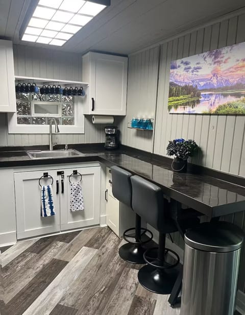 Start your mornings at the breakfast bar with coffee in hand and end your evenings cooking up favorite meals in this bright, inviting kitchen.