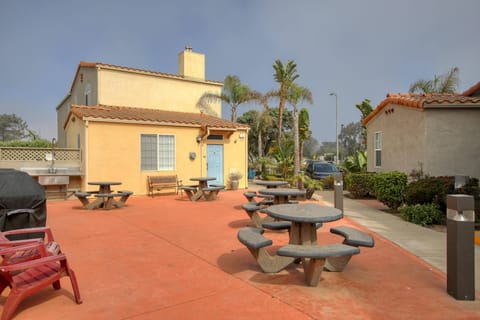 Grill, chill, and dine in the shared BBQ area—complete with a natural gas grill, picnic tables, and a prep sink for easy outdoor meals.