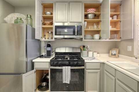 You'll find everything you need to prepare meals in the well-appointed kitchen. It comes fully stocked with dishware, glassware, cutlery, and a complete set of quality pots and pans, making it easy to enjoy home-cooked meals during your tranquil retreat.
