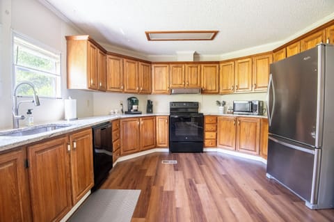 This spacious kitchen is stocked and ready for cooking, baking, or grazing all day.