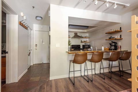 This open-layout kitchen offers efficient service for guests, with ample counter space for prep and easy access to dining and living areas—ideal for hosting or quick, convenient meals.