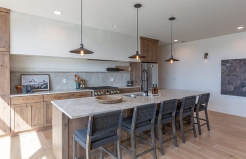 Upscale kitchen with large kitchen island with dining area