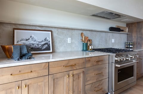 Beatiful kitchen with quarts and naual wood finishes