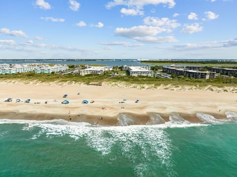 Experience the ultimate beachfront getaway with direct access to sandy shores, stunning ocean and sound views, and proximity to Fort Macon and Morehead City.