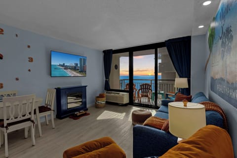 The fireplace glows, the ocean lights up gold — this is your morning at Lil’ Salty.