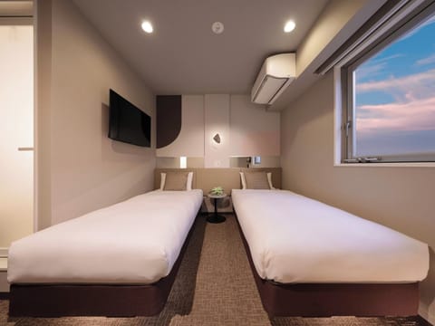 Twin room Size: 15-22㎡ Bedding: 2 single beds Capacity: 1-2 people