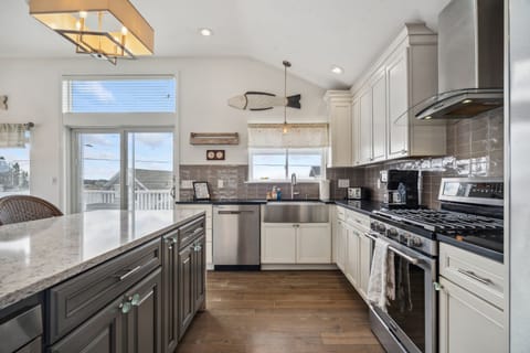 Fully equipped kitchen with all major appliances, waterfall island with seating for 4, and a view of the Plum Island Basin!