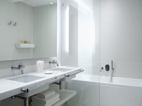 Designer toiletries, hair dryer, bathrobes, slippers