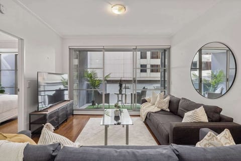 A spacious living with a 3-seater sofa bed that folds out to a double and a 3-seater couch.