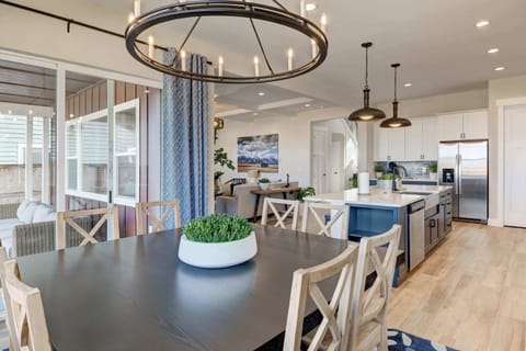 Kitchen: Cook in style with modern stainless steel appliances, chic cabinetry, and a beautiful backsplash that ties it all together.
