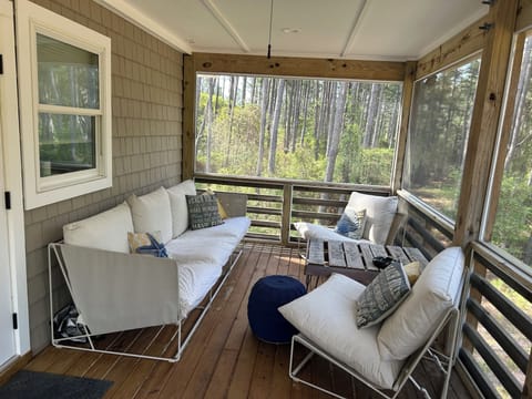 Back Porch, screened in, comfy furniture perfect for an afternoon nap.