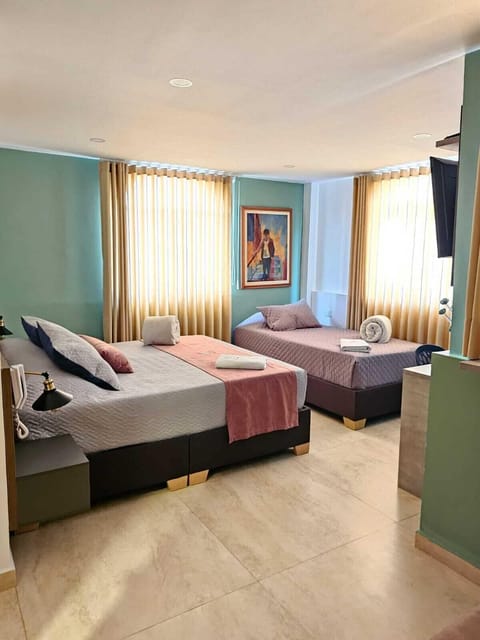 Triple Room | Iron/ironing board, WiFi (free), bed sheets