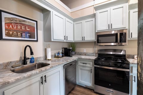 Fully equipped kitchen with vintage flair — enjoy a home-cooked meal before a stroll through Laurel’s famous historic district.