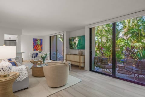 A modern, light and airy living space designed for pure vacation relaxation. Access to the patio via sliders