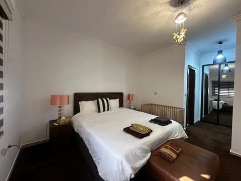 master bedroom with ensuite bathroom and lots of closets; cot on request