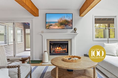 Welcome to Forest House —where rustic beams meet modern comfort. This living room glows with charm!