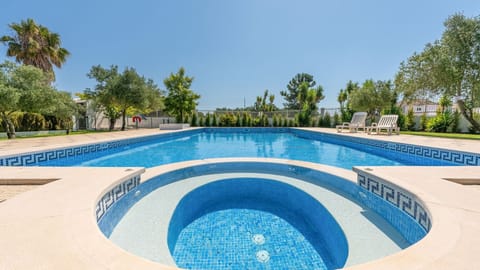 Refresh in the large pool surrounded by lush greenery—your ultimate summer retreat awaits! #PoolsideBliss #SummerVibes #Portugal #PT