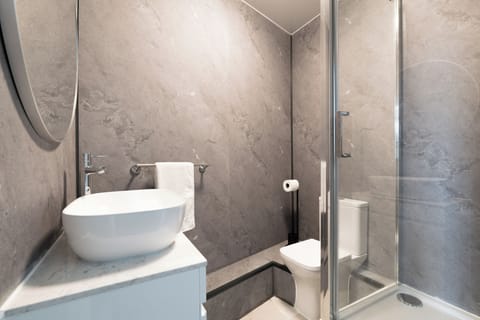 Shower, slippers, towels, soap