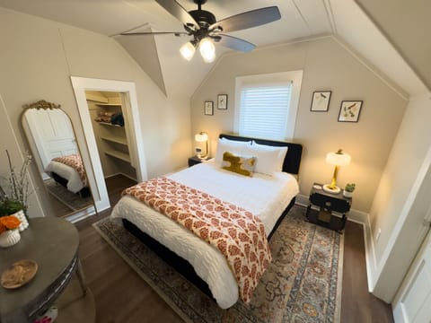 Bedroom with queen hybrid mattress, spacious closet and dresser, and USB charging on both nightstands.