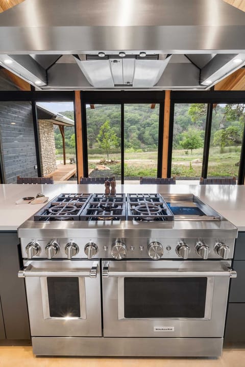 Chef's dream kitchen featuring a premium gas range and stunning views to inspire every meal.