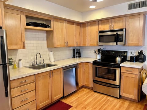 Large Kitchen with all essentials for cooking a meal.