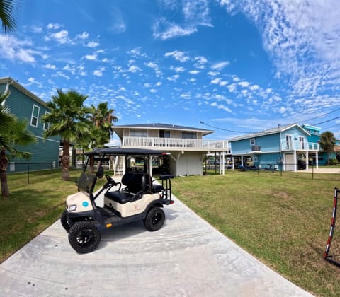 Front of the home with golf cart
