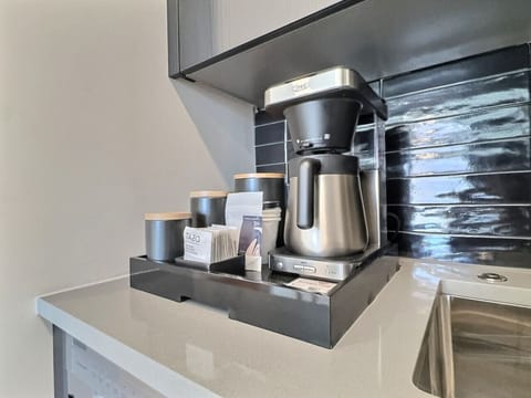 Fresh coffee anytime in the comfort of your room, perfect for a short-term rental.