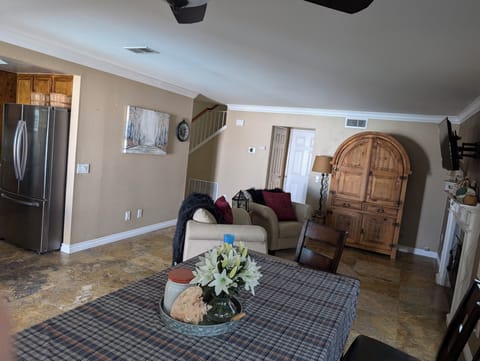 Family room and dining table.  Queen aero bed with linens in Mexican cabinet 