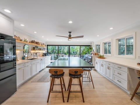 Newly remodeled kitchen is stylish, functional. 10' island with seating for 6-8.