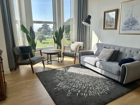 Open plan living area with sea views
