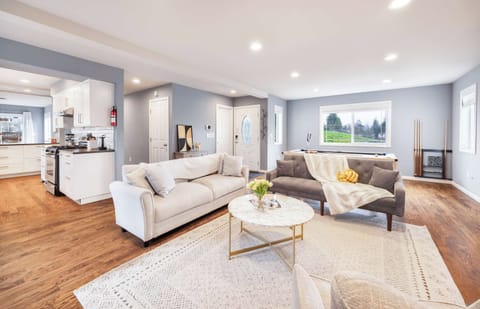 The kitchen’s stocked and connected to the living room—ideal for game nights or family dinners.