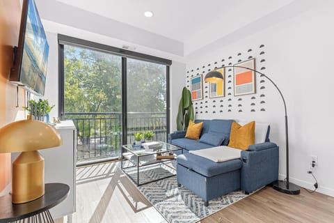 Bright modern lounge with balcony views and abundant natural light