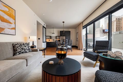 3BR Lavish Penthouse + Canal St Private Patio | The Mayfair | Living area | 65-inch Smart TV with cable channels, Netflix, Hulu