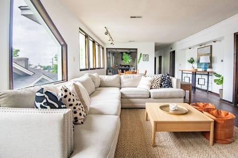 Open layout flows beautifully between the living, dining, and kitchen areas.