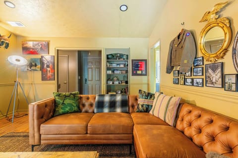 Spacious living room with cozy seating and entertainment options — ideal for relaxing evenings near Fort Moore, GA.