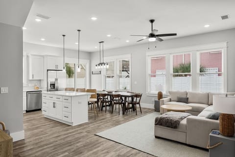 Large kitchen with bar seating and stainless appliances
