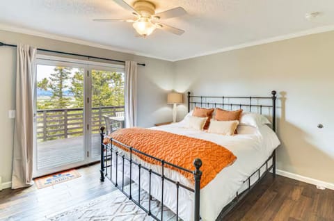 Master bedroom with access to big deck overlooking the property. 