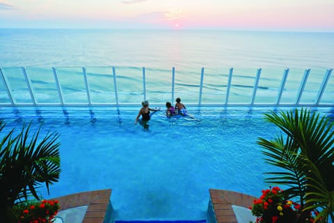 Indoor pool, seasonal outdoor pool, pool umbrellas, sun loungers