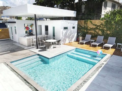 Modern oasis with private pool, outdoor kitchen, and stylish lounge spaces!