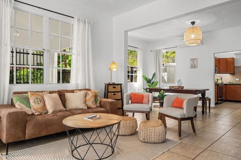 Bright tropical living area with boho decor and natural light