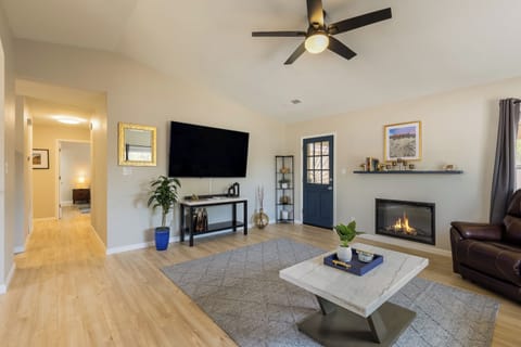 Enjoy the open floor plan with a 72" smart   TV and beautiful LED fireplace.